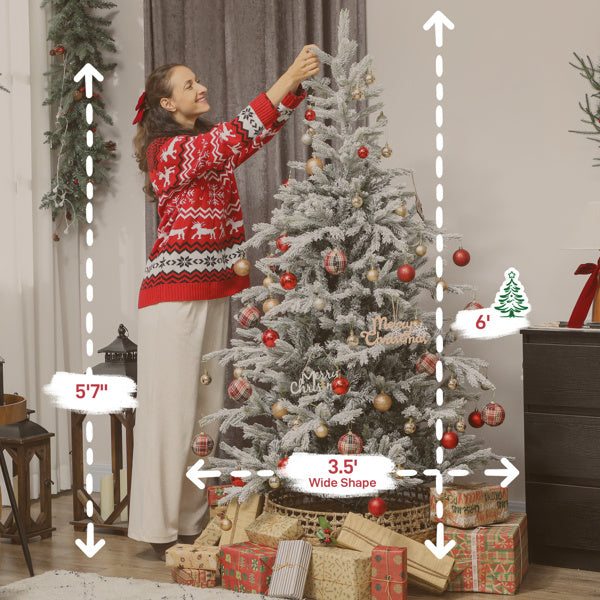 6ft flocked Christmas tree decorated with red and gold ornaments beside a 5'7" woman in a festive sweater and surrounded by wrapped gifts