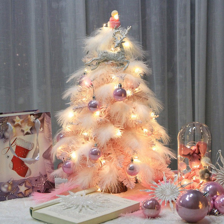 Small pink feather Christmas tree ornament with LED lights and purple baubles for desktop decoration
